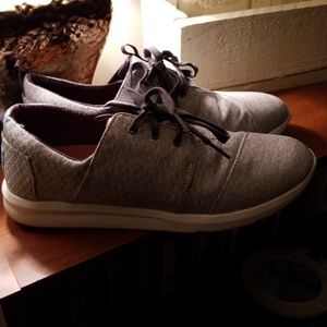 Gray TOMS sneakers.